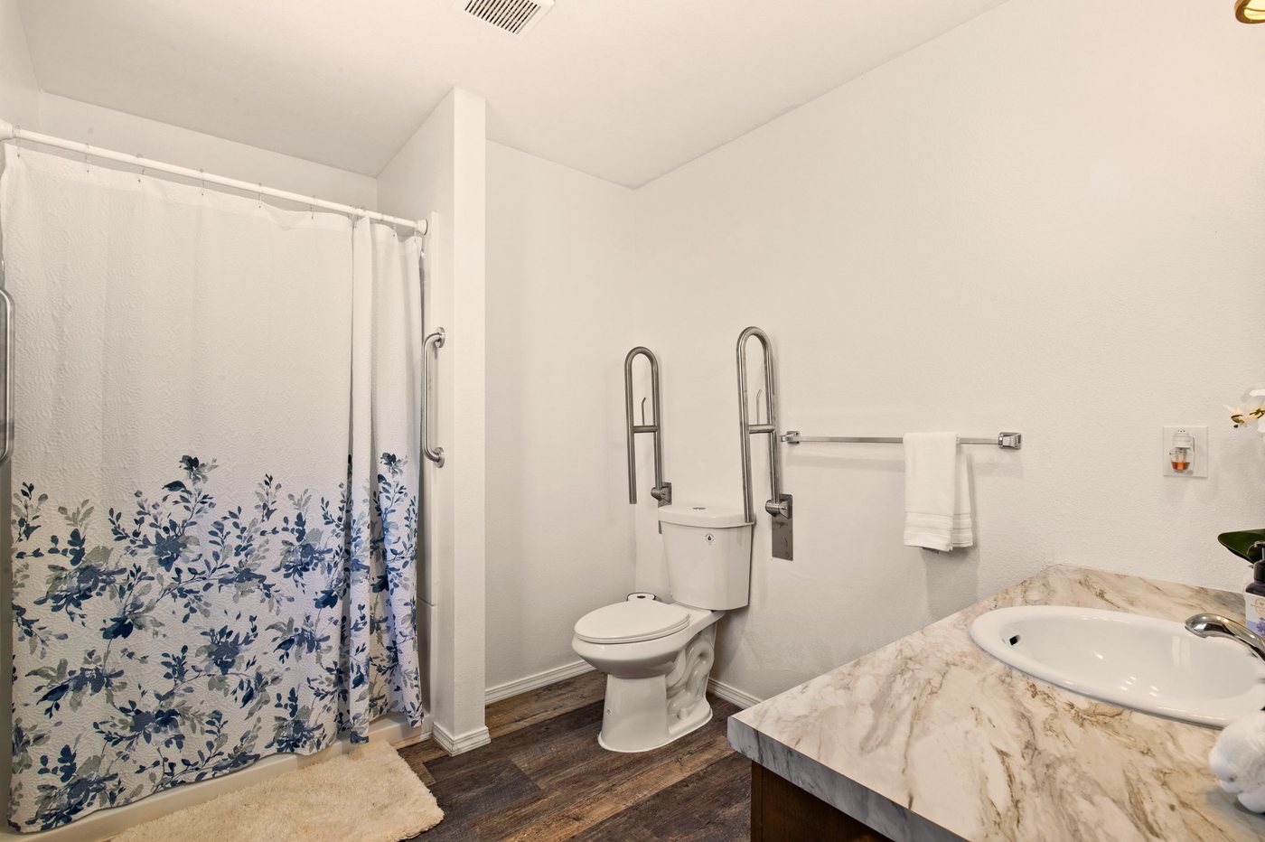 An accessible bathroom with safety grab bars